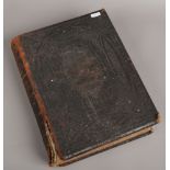 A leather bound copy of Brown's self - interpreting family bible, prints by Adam & co Ltd