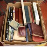 A box of books including early 20th century Victorian hymns and hardback novels.