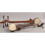 Two Indian stringed instruments.
