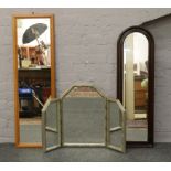 A group of three mirrors to include two full length and a dressing table triple mirror.