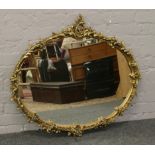 A large ornate gilt framed mirror.