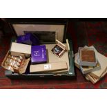 A box of miscellaneous to include commemorative glasses, brush sets, cased Kigu compact, two