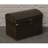 A twin handle tin trunk.