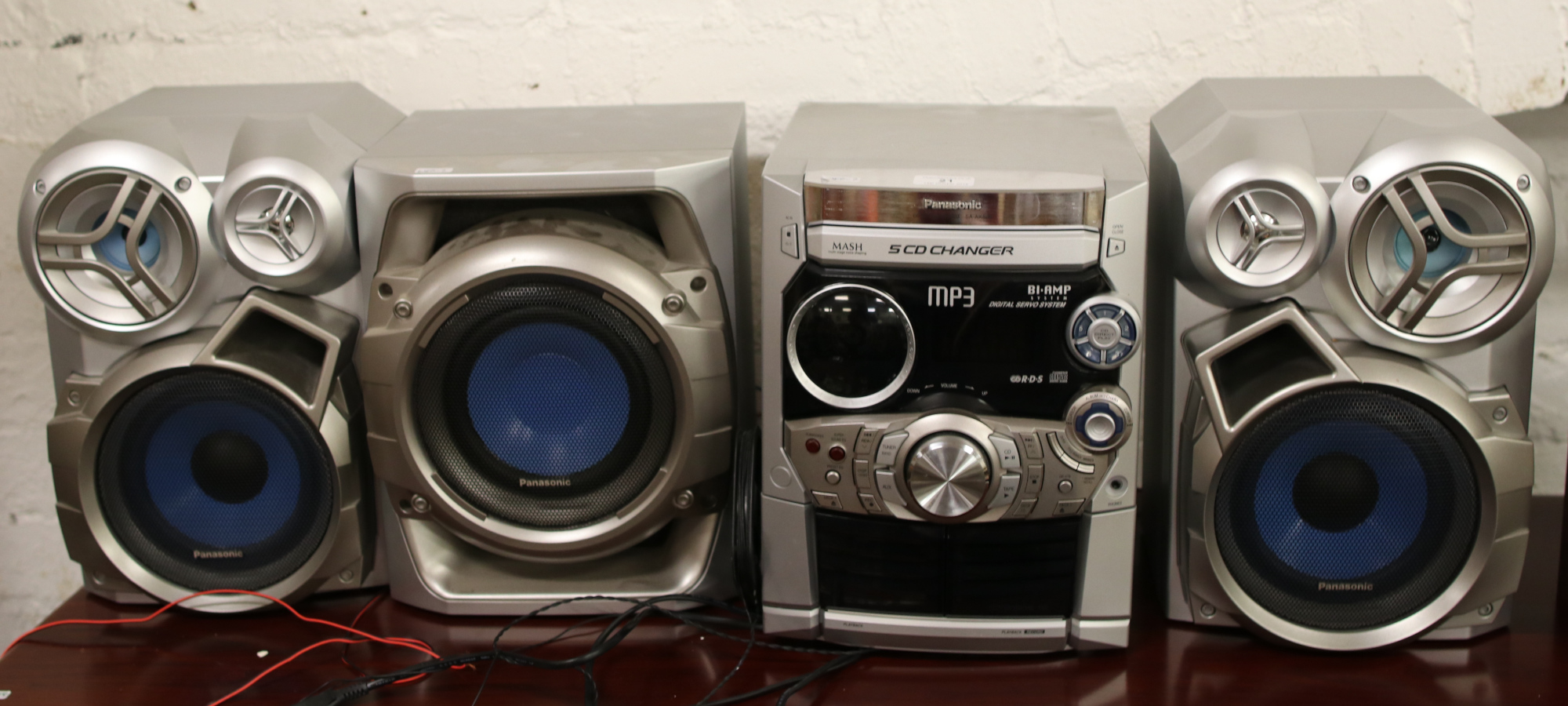 A Panasonic C.D stereo system with sub woofer and two speakers.