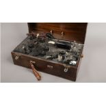 A Stanley Cox Limited electric shock machine in wooden case.