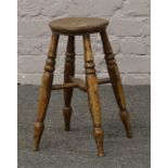 A turned leg kitchen stool.