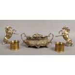 A small group of brassware to include Art Nouveau centre piece, two decorative rearing horses and