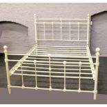 A Laura Ashley style cream double bed with shell motifs.