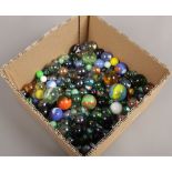 A box of various glass marbles.