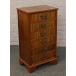 A small mahogany chest of six drawers with crossbanded inlay.