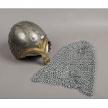 A reproduction battle helmet and head chain mail.