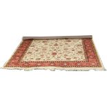 A beige ground Keshan rug with floral design, 2.3m x 1.6m.