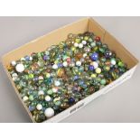 A box of various glass marbles.