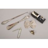 A collection of silver items cased serviette ring, mother of pearl handle fruit knife, silver