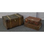 A compressed fibre and leather, wooden bound travel trunk with label Featherweight trade mark, along