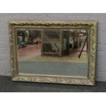 An ornate gilt framed bevel edge wall mirror 11 x 8 cm.