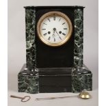 A French slate and marble 8 day mantel clock by F. Poulet Paris chiming on a bell.