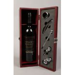 A mahogany glazed wine set with Wurttemberg 2005 Trollinger produced in Germany.