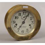 A brass US Navy deck clock No. 3 with silvered dial made by Seth Thomas USA, with key.