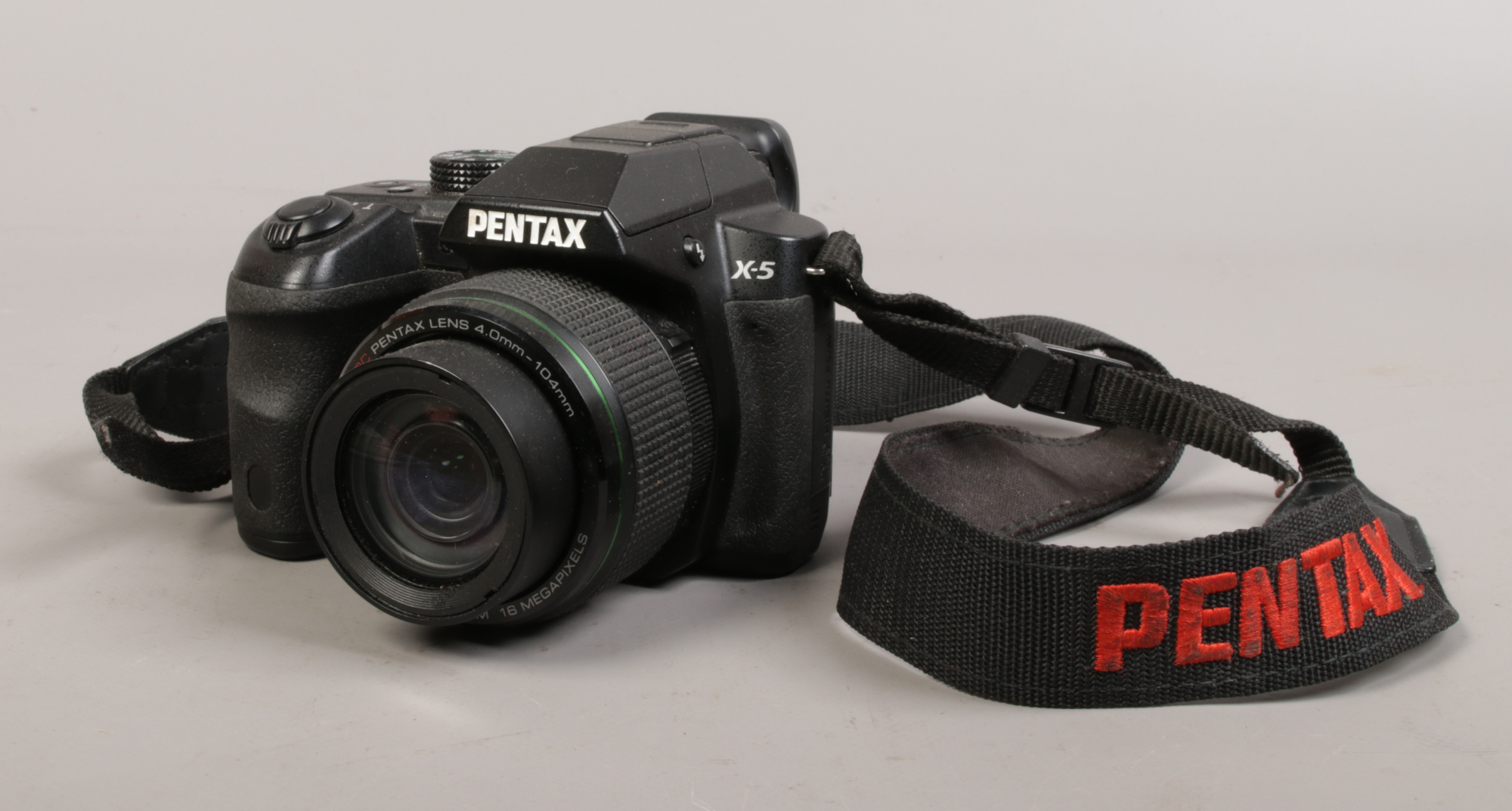 A Pentax x-5 16 megapixels compact camera with wide optical zoom.