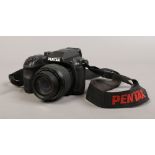 A Pentax x-5 16 megapixels compact camera with wide optical zoom.
