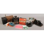 A box of photographic equipment to include Konica C35, Agfalux flash colour swinger Polaroid land