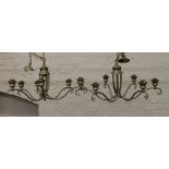 A pair of six branch pewter effect ceiling lights.