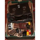 A box of photographic equipment to include vest pocket auto graphic Kodak camera, Mayor Paris pair