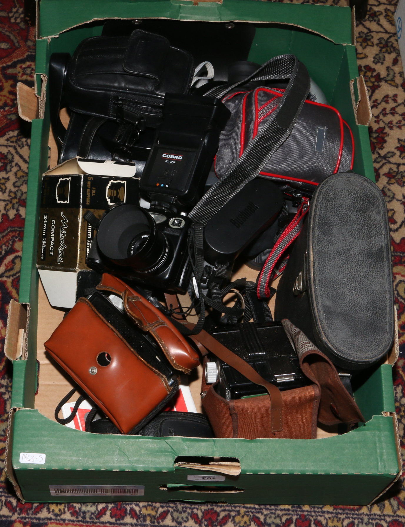 A box of photographic equipment and binoculars including a Coronet Captain, Nikon Coolpix 5000,