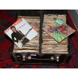 A carry case and contents of single records, mainly pop and easy listening.