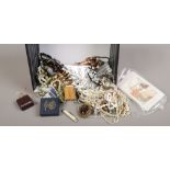 A box of costume jewellery to include glass beads, simulated pearls, brooches etc.