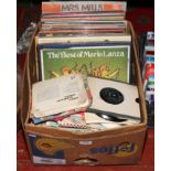 A box of L.P records and singles to include Shirley Bassey, Fabulous Fifties set, Des O' Connor