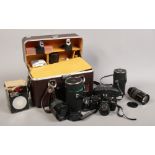 A photographic carry case and contents of Pentax MV 1 camera, Makinon lenses f = 80 - 200mm, f =
