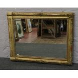 A gilt painted and decorated wall mirror, 11.2cm x 9cm.