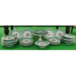 A twenty seven piece dessert service to include comports, green ground with gilt borders decorated