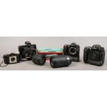 A collection of photographic to include Nikon D2 X and D80 cameras, Nikon lenses, Polaroid Instant