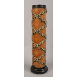 A wallpaper printing roll formed as a table lamp base decorated with trailing foliage, height 58cm.