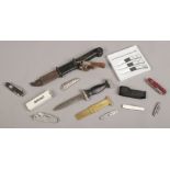 A collection of knives, pocket knives and a multi tools to include boxed three piece outdoorsman