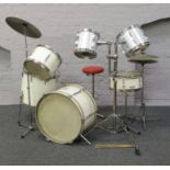 An Olympic eight piece drum kit with music stands, seat side drums and symbols etc.