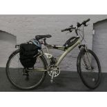 A gentleman's Decathlon touring pedal cycle with twist grip gears suspension Panniers lights