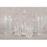 A collection of cut glassware's to include decanters, vases etc.