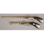 Two decorative wall mounted ornamental guns to include a blunderbuss and a single barrel shot gun