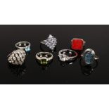 Seven silver dress rings including iolite, peridot etc.