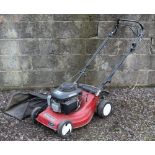 A Honda GCV 135 Mountfield petrol lawn mower.