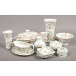 A collection of Minton Haddon Hall ceramics to include lidded tureen, vases, pin dishes etc.