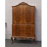 A carved walnut cocktail cabinet on cabriole supports.Condition report intended as a guide only.