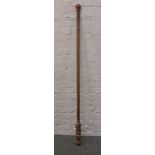 A Victorian mahogany curtain pole. (approx length 175cm, diameter 4.5cm)Condition report intended as