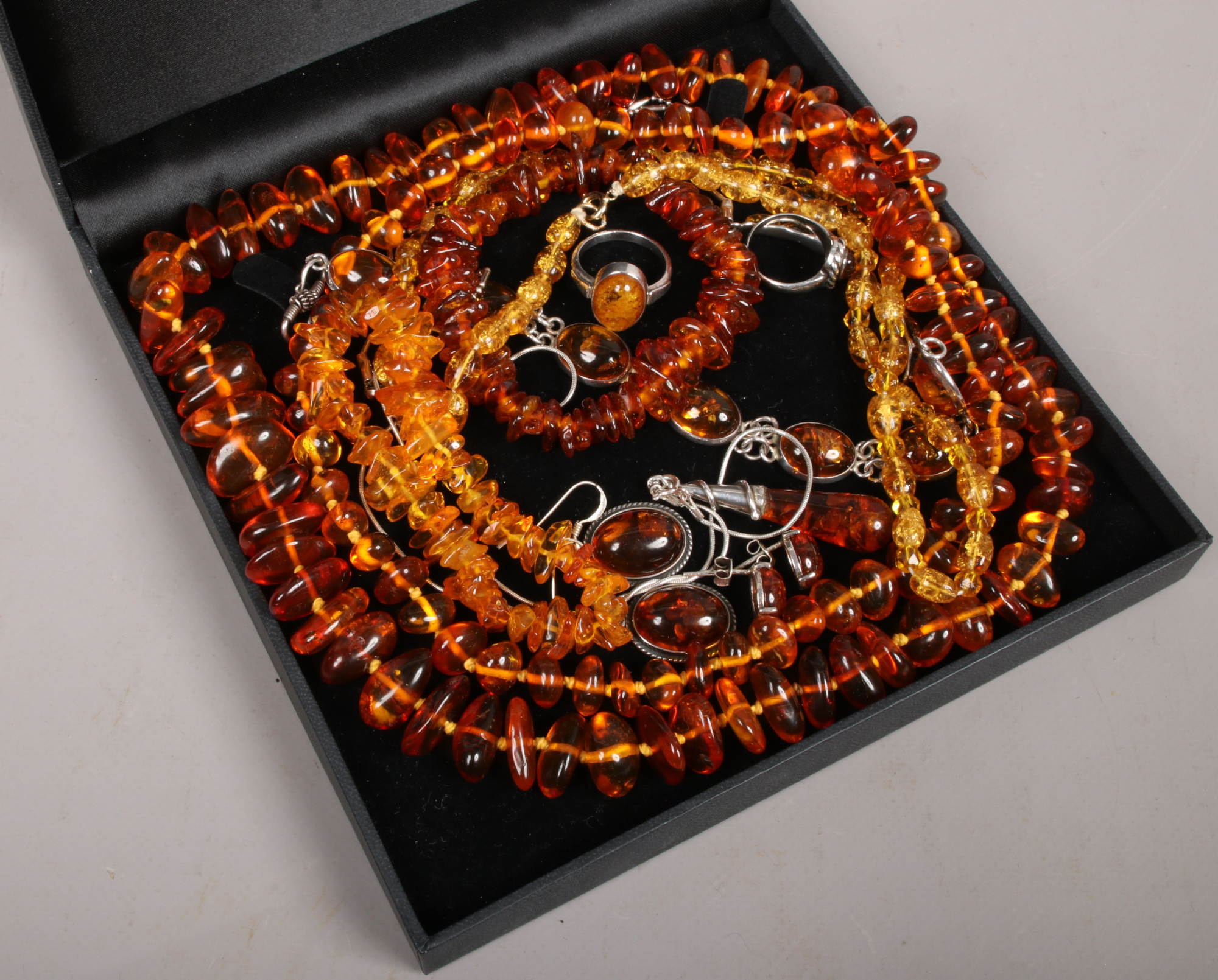 A collection of mixed Baltic amber jewellery including silver mounted examples.