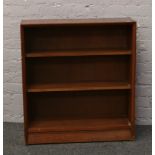 A mahogany open front bookcase.