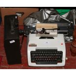 A cased Imperial portable typewriter along with an Olympia typewriter with spare ribbons and
